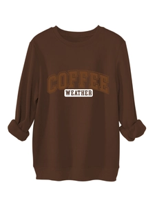 Detail of coffee brown sweatshirt showing ribbed cuffs and retro coffee weather print