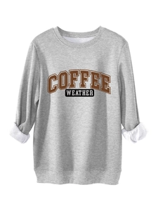 Detail of grey sweatshirt showing soft white fleece lining and Coffee Weather print