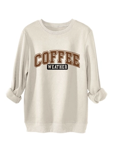 Detail of coffee weather graphic on a beige thick cotton long sleeve sweatshirt