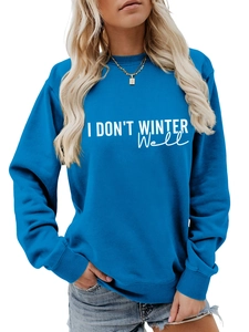 Detail of royal blue sweatshirt with I Don't Winter Well white text and ribbed cuffs