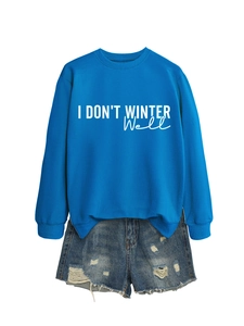 Detail of royal blue pullover sweatshirt featuring white I DON'T WINTER WELL slogan print
