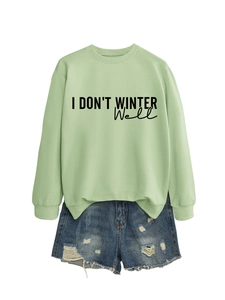Detail of sweatshirt with I DON'T WINTER WELL print and distressed denim shorts