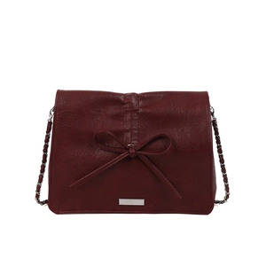 Elegant wine red tote bag with leather bow charm and silver chain shoulder strap