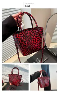 Detail view of red leopard print tote bag with glossy finish and silver metal hardware