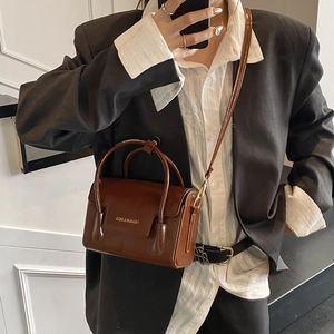 Retro dark brown rectangular handbag with top handles and adjustable crossbody strap