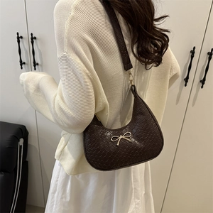 Urban minimalist dark brown woven crescent hobo bag with gold bow knot and wide strap
