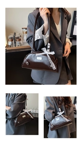 Detailed view of coffee brown shoulder bag with lace bow and silver logo plaque
