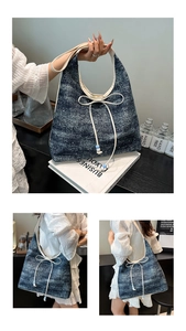 Close-up of large denim tote bag featuring a white bow detail and beaded drawstring