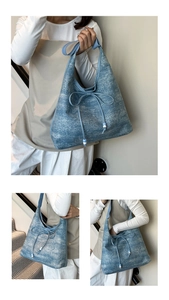 Detailed close-up of blue textured canvas tote bag with bow and bead accents