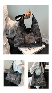 Close-up of dark grey tweed tote bag with bow detail and shimmering texture