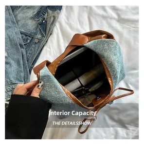 Large capacity denim and leather tote showing interior space with daily essentials