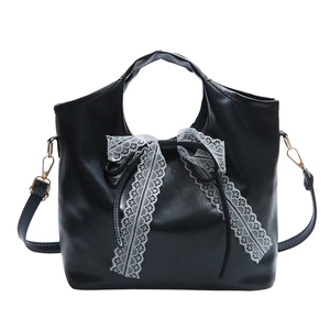 Minimalist black oil wax leather handbag with white lace bow and gold hooks