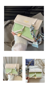Detail of cream and green crossbody bag with leather texture and printed silk scarf