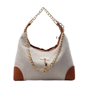Sac bandoulière en toile bicolore chic avec chaîne dorée et finitions en cuir