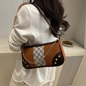 Fashionable chain crossbody bag with color blocking and vintage jacquard fabric detail