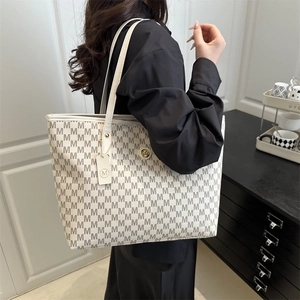 Large off-white tote bag with grey M-letter print and golden logo charm detail