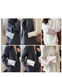 Detailed views of floral envelope chain bags in light blue, beige and pink finishes