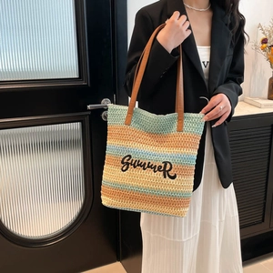 Handwoven blue and yellow striped bucket tote bag with Summer embroidery and leather handles