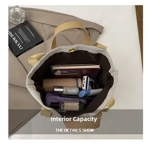 Macro view of large canvas tote bag internal capacity with multiple storage compartments