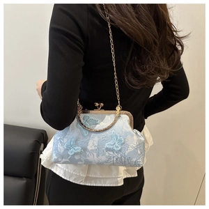 Detail of light blue jacquard crossbody bag with delicate 3D butterfly appliques