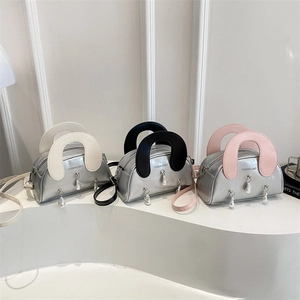 Metallic silver shell bags with contrasting handles and pearl charm in three colors