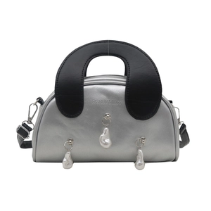 Chic silver metallic shell handbag with large black handle and pearl pendants