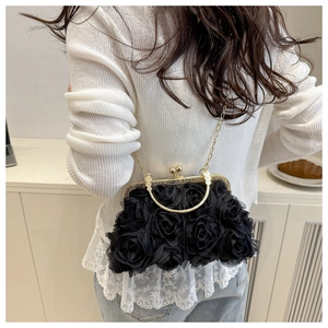 Detail view of 3D black mesh rose evening bag with vintage gold chain strap