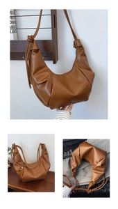 Detail of vintage dark brown dumpling bag featuring pleated texture and knot shoulder strap