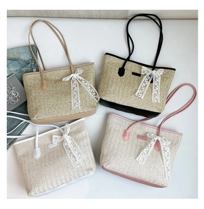 Detail of four colorful woven straw tote bags featuring delicate lace bows and leather straps