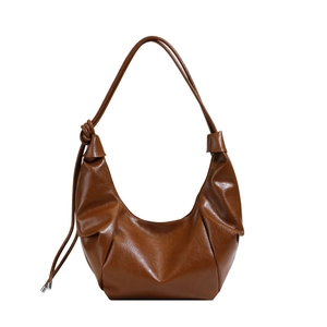 Brown semi-circle hobo bag in shiny PU leather with knot shoulder strap details
