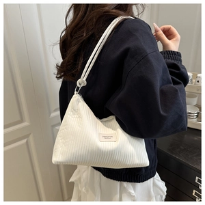 Detail of white pleated tote bag showing the fine texture and elegant JINGPIN fashion logo