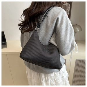 Detail of black pleated hobo bag texture with a JINGPIN Fashion leather label