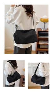 Détail de la bandoulière en nylon noir avec logo FY embossé et finitions stylisées