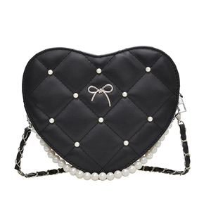 Black heart-shaped quilted handbag with elegant pearl embellishments and bow charm