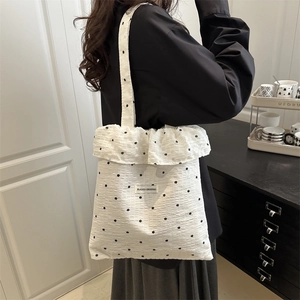 White floral tote bag with ruffle trim and bubble crepe texture for summer school or commute