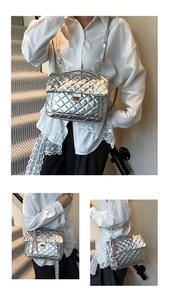 Close-up of silver quilted texture and gold turn-lock closure on the flap bag