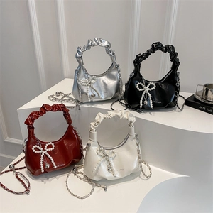 Bow knot pleated crossbody bags with pearl heart charms in silver, black, red, and beige
