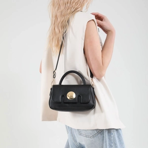 French style black leather crossbody bag with gold round buckle and top handle