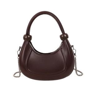 Deep brown crescent shoulder bag with metallic chain and unique sphere handles
