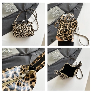 Detail views of leopard print patent leather bag showing base, zipper and interior lining