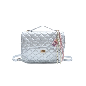 Silver quilted tote bag with metallic finish and gold twist lock in frontal view