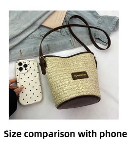Size comparison showing the woven bucket bag next to a smartphone for scale