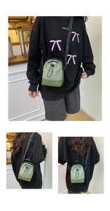 Detailed views of crossbody phone bag featuring green contrast panels and drawstring