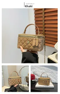Detail of khaki quilted mini bucket bag with gold chain and floral metal ornament