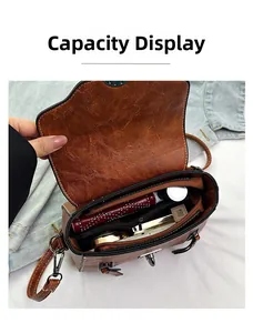 Detailed capacity display showing interior compartments of the brown leather crossbody bag