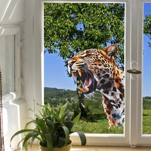 Detail view of a realistic leopard head window sticker showing intricate fur and spot textures