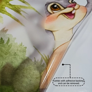 Detail showing the removable adhesive backing of the cartoon rabbit wall sticker