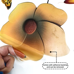 Detail showing self-adhesive backing being peeled off the floral butterfly wall decal