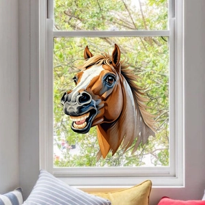 Detailed view of a funny cartoon horse window sticker applied on a transparent glass pane