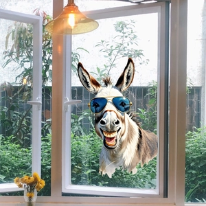 Funny donkey with sunglasses window sticker shown on glass with a garden view